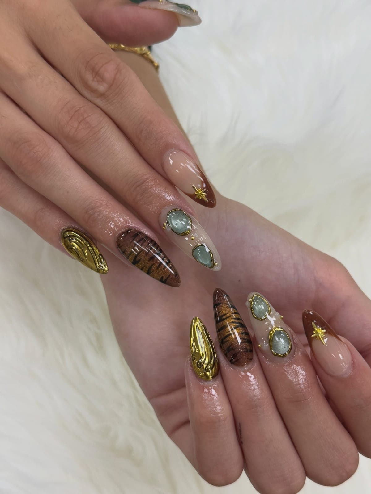 Bronze and gold chrome almond nails