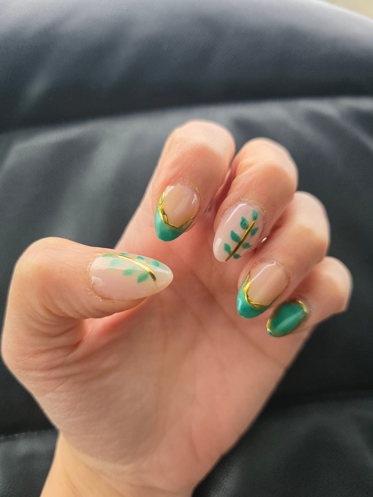 Green French tips with hand-painted leaves