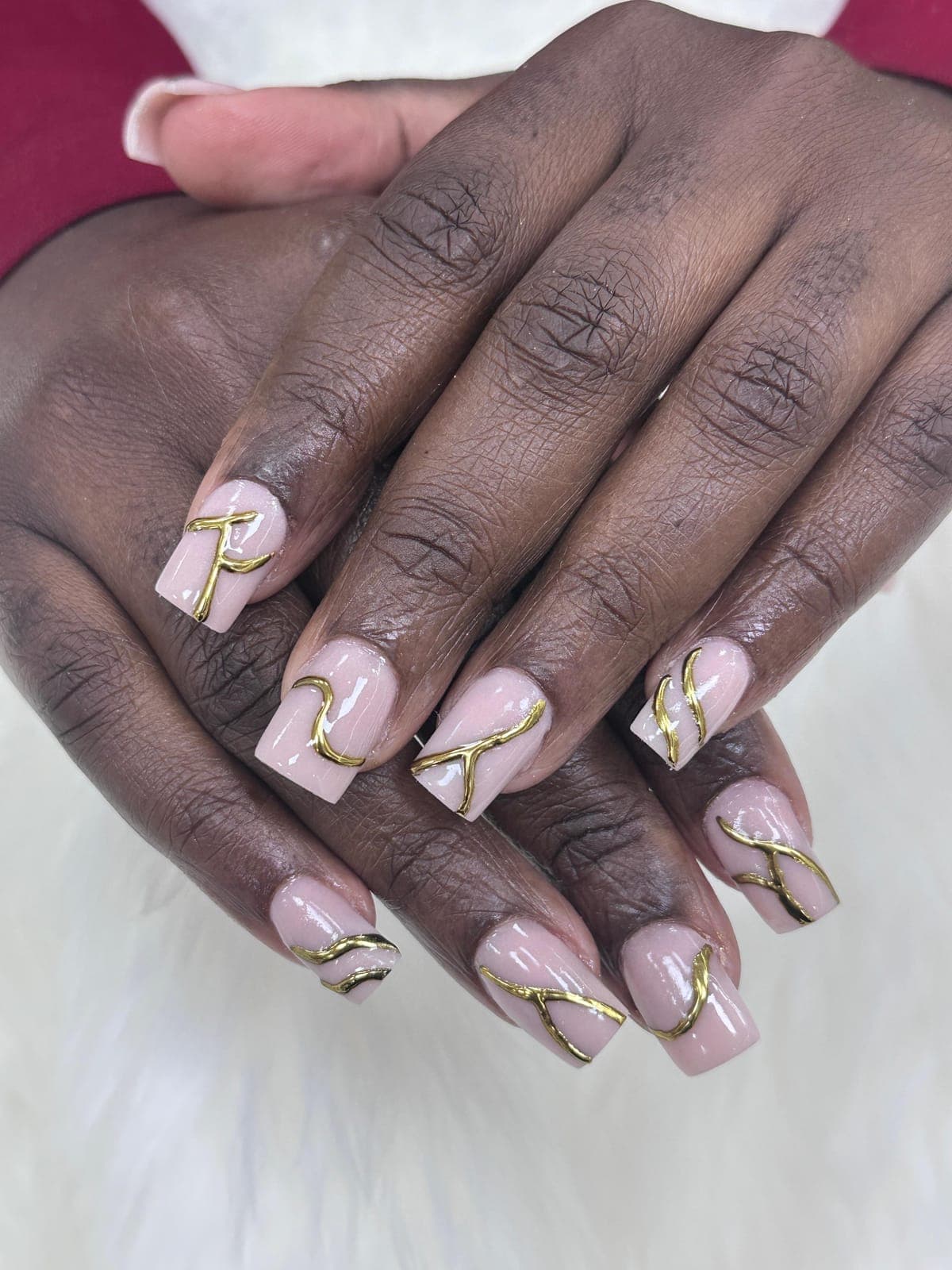 Nude nails with gold line art