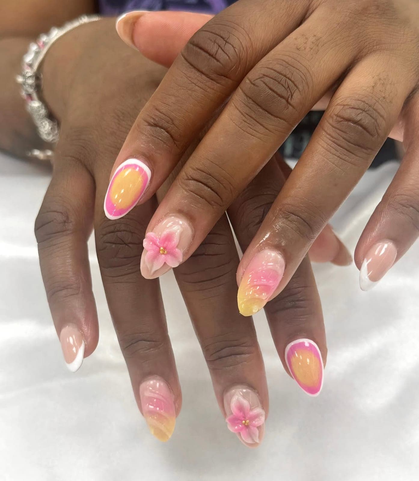 Pink aura almond nails with 3D flowers