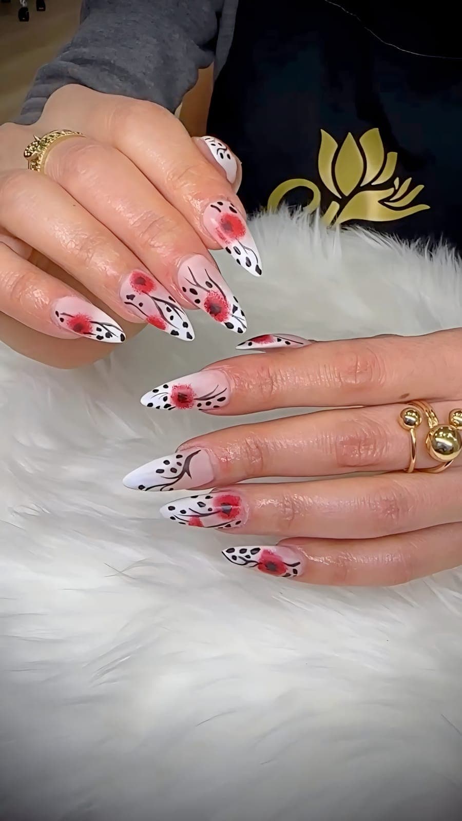 Almond nails with red flowers and black dots